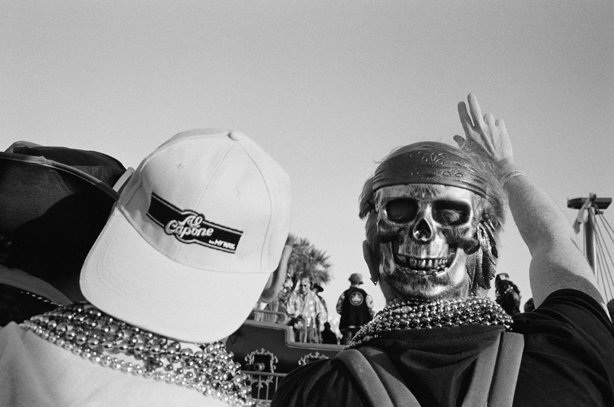 People fishing for beads during the Gasparilla parade in Tampa, FL