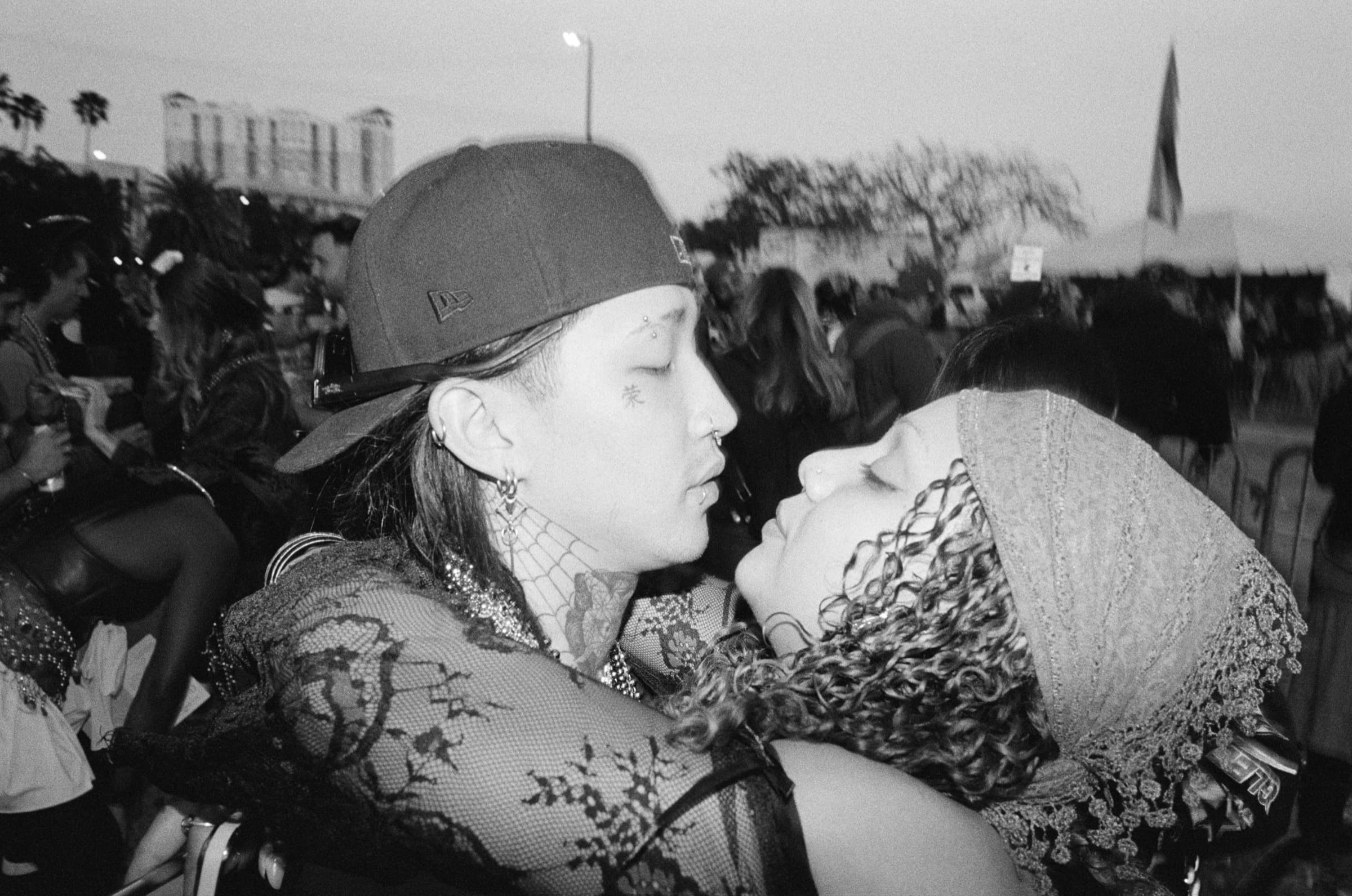 Two people embracing during the Gasparilla parade in Tampa, FL